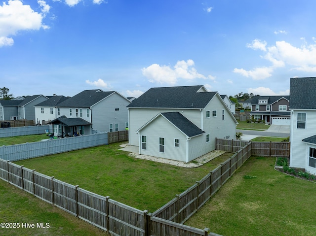 555 Heartwood Dr, Leland, NC 28479 - exterior space featuring a fenced backyard, a residential view, and a lawn