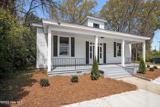 bungalow-style home featuring a porch and crawl space