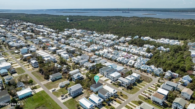 1205 Mackerel Ln Unit 2, Carolina Beach, NC 28428 - bird's eye view featuring a wooded view and a residential view