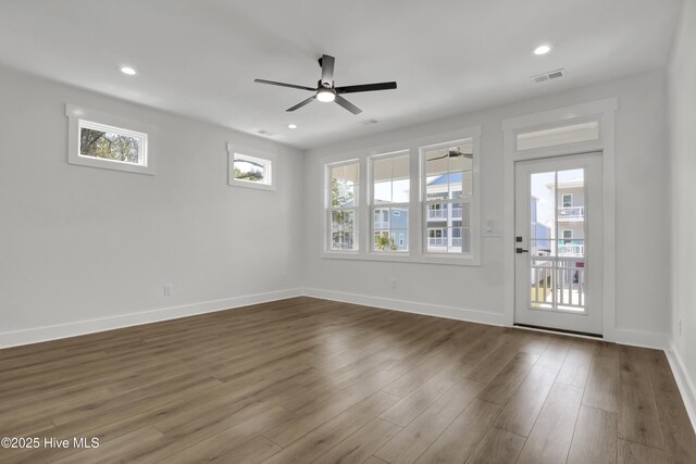 1205 Mackerel Ln Unit 2, Carolina Beach, NC 28428 - unfurnished room with visible vents, baseboards, a ceiling fan, and wood finished floors