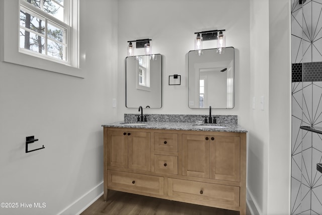 1205 Mackerel Ln Unit 2, Carolina Beach, NC 28428 - full bath with double vanity, baseboards, a sink, and wood finished floors