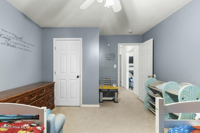 carpeted bedroom featuring a ceiling fan