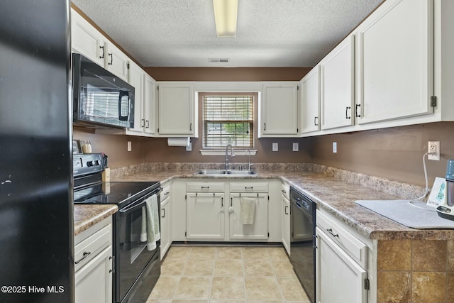 kitchen featuring white cabinetry, a textured ceiling, black appliances, visible vents, and a sink