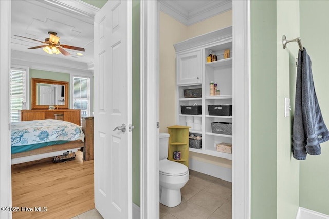 bathroom with tile patterned floors, ensuite bath, crown molding, toilet, and a ceiling fan