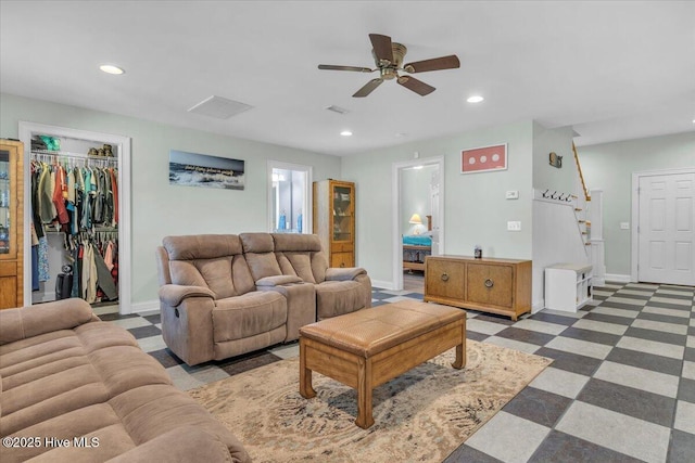living area featuring recessed lighting, stairs, baseboards, and ceiling fan