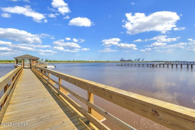 view of dock with a water view and a gazebo
