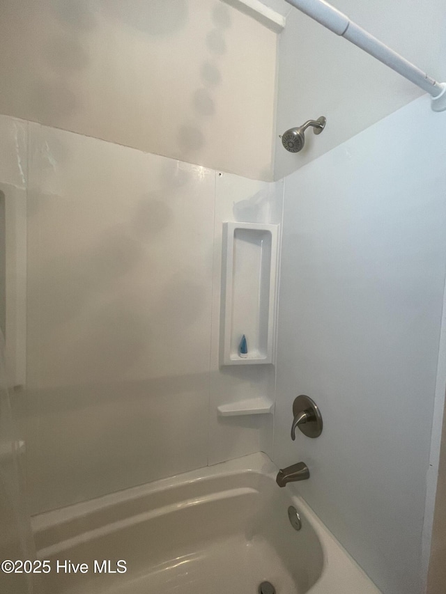full bath featuring bathing tub / shower combination