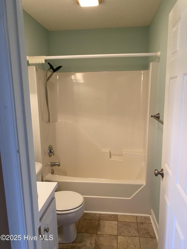 bathroom featuring tile patterned flooring, vanity, toilet, and shower / bath combination