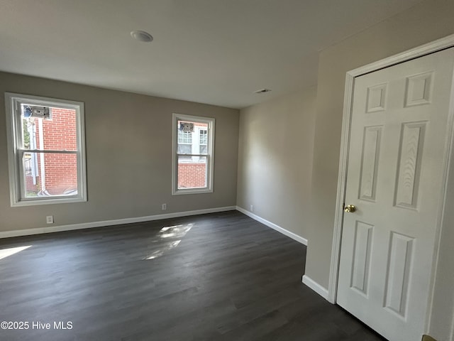915 N Broad St, Edenton, NC 27932 - spare room featuring baseboards and dark wood-style flooring