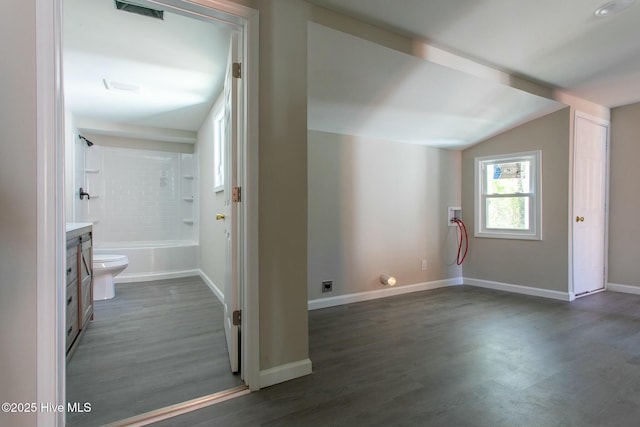 915 N Broad St, Edenton, NC 27932 - additional living space with dark wood-type flooring, baseboards, and lofted ceiling