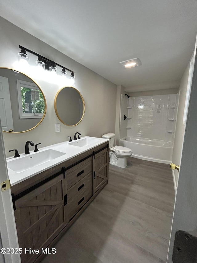 915 N Broad St, Edenton, NC 27932 - full bath with toilet, shower / bath combination, wood finished floors, and double vanity