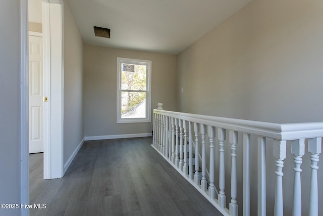915 N Broad St, Edenton, NC 27932 - corridor featuring wood finished floors, baseboards, and an upstairs landing