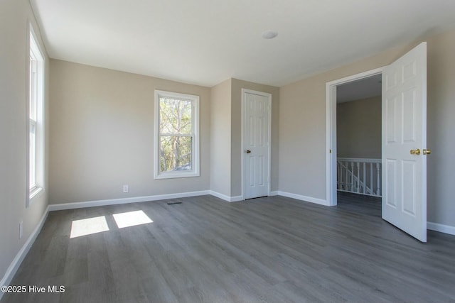 915 N Broad St, Edenton, NC 27932 - unfurnished bedroom with dark wood finished floors and baseboards