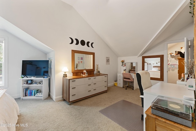 office area with baseboards, light colored carpet, and vaulted ceiling