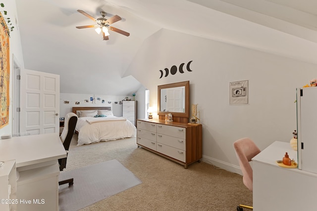 bedroom featuring light colored carpet, baseboards, a ceiling fan, and lofted ceiling
