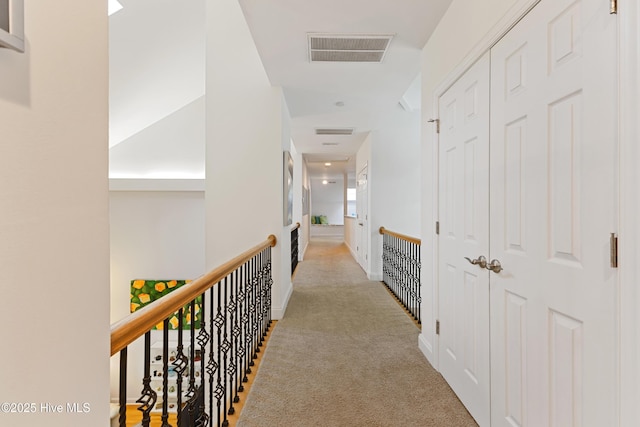 corridor featuring carpet and visible vents