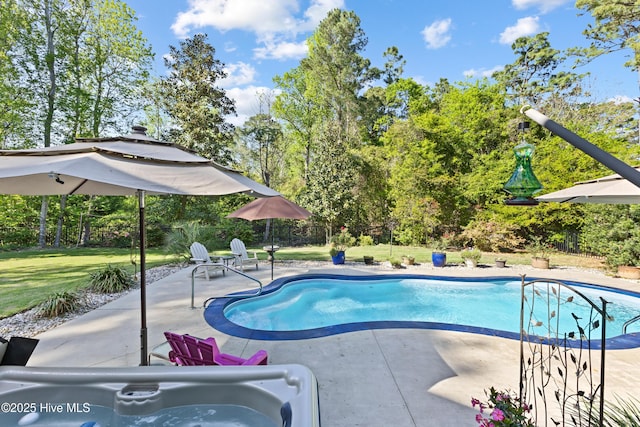 view of swimming pool with a fenced in pool, a patio, fence, and a lawn