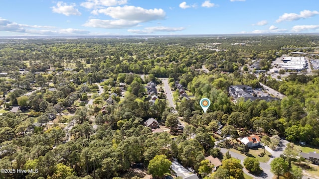 birds eye view of property with a residential view and a view of trees