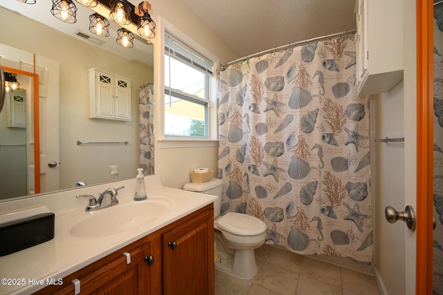 bathroom with visible vents, a shower with curtain, toilet, vanity, and tile patterned floors