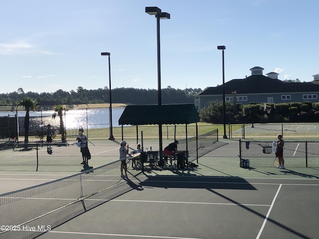 8372 S Shoreside Way NE, Leland, NC 28451 - view of tennis court with a water view