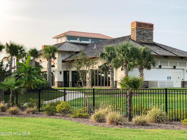 8372 S Shoreside Way NE, Leland, NC 28451 - back of property featuring stone siding and a chimney