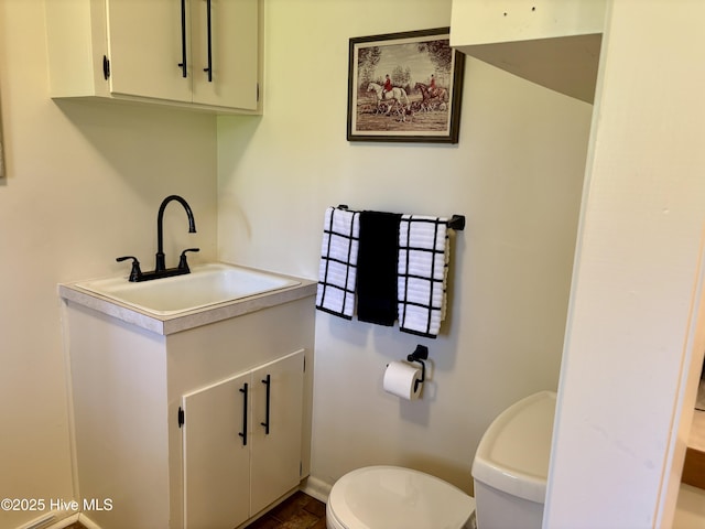 207 Bump A Long Ln, Southern Pines, NC 28387 - bathroom featuring vanity, baseboards, and toilet