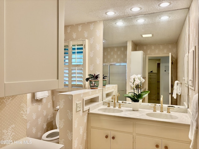 207 Bump A Long Ln, Southern Pines, NC 28387 - full bathroom featuring a shower stall, a sink, wallpapered walls, and a textured ceiling