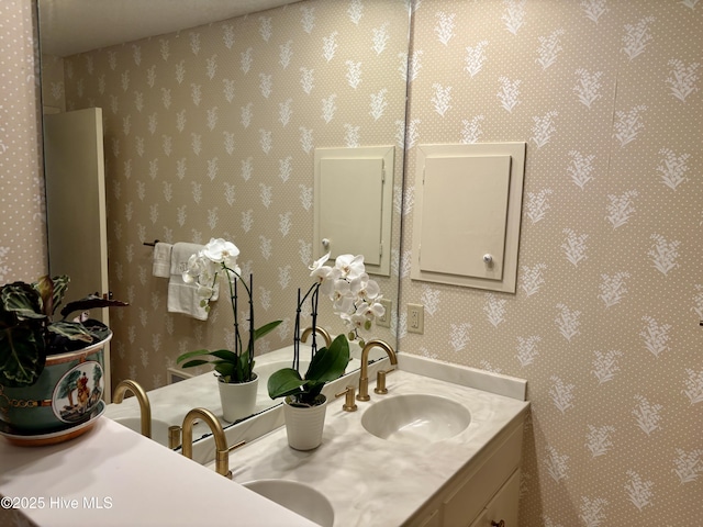 207 Bump A Long Ln, Southern Pines, NC 28387 - bathroom featuring wallpapered walls, double vanity, and a sink