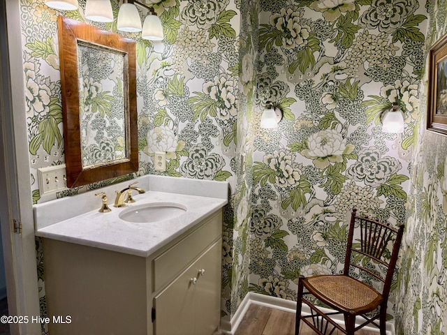207 Bump A Long Ln, Southern Pines, NC 28387 - bathroom featuring vanity, wallpapered walls, and wood finished floors