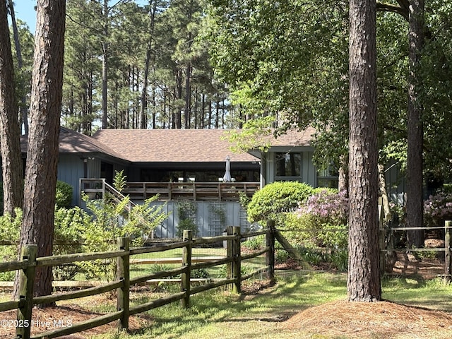 207 Bump A Long Ln, Southern Pines, NC 28387 - single story home featuring roof with shingles, board and batten siding, and fence