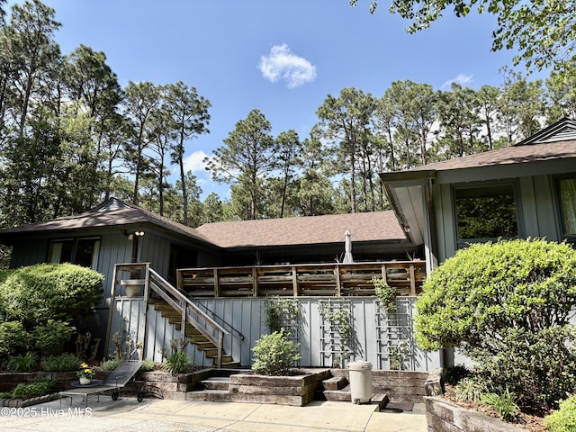 207 Bump A Long Ln, Southern Pines, NC 28387 - rear view of property with stairway, board and batten siding, and a shingled roof
