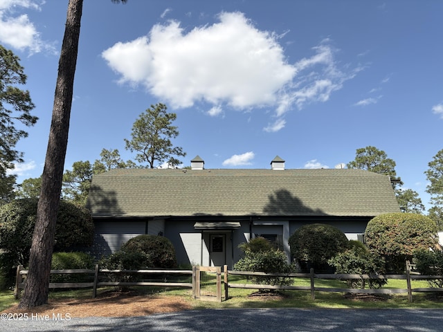 207 Bump A Long Ln, Southern Pines, NC 28387 - view of front of property featuring a shingled roof and a fenced front yard