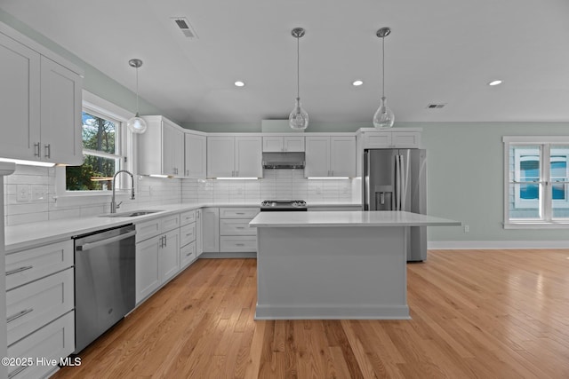 1129 Bennett Rd Unit 8B, Minnesott Beach, NC 28510 - kitchen featuring decorative backsplash, appliances with stainless steel finishes, a sink, and visible vents