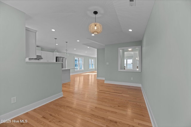 1129 Bennett Rd Unit 8B, Minnesott Beach, NC 28510 - unfurnished living room featuring baseboards, light wood-style floors, visible vents, and recessed lighting