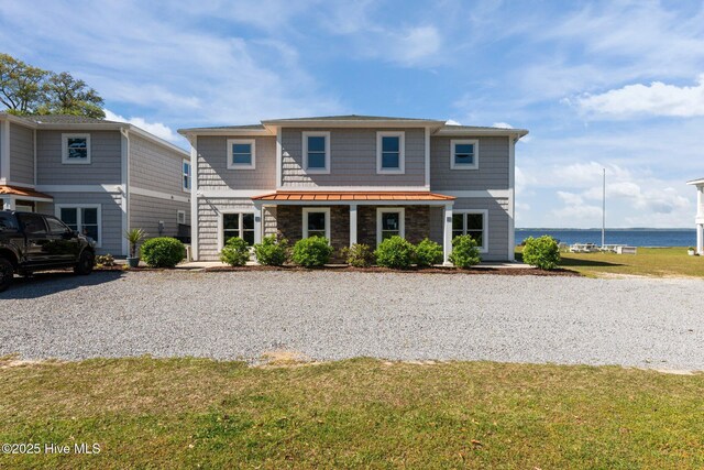 1129 Bennett Rd Unit 8B, Minnesott Beach, NC 28510 - view of front of house featuring a front yard and a water view