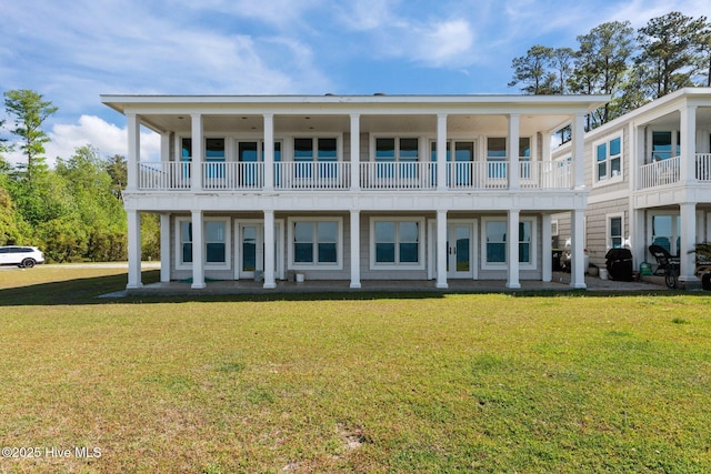 1129 Bennett Rd Unit 8B, Minnesott Beach, NC 28510 - rear view of house with a lawn