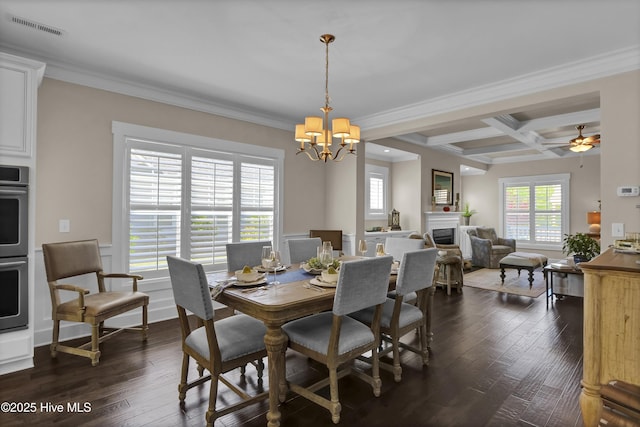 dining area with a chandelier, visible vents, a healthy amount of sunlight, and coffered ceiling