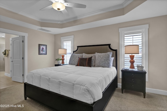 bedroom featuring visible vents, baseboards, crown molding, and light carpet