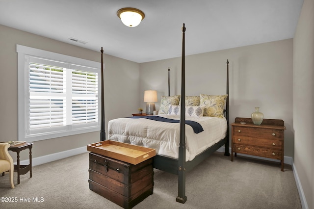 carpeted bedroom with baseboards and visible vents