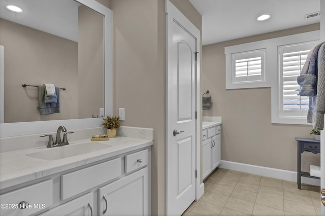 bathroom featuring vanity, tile patterned floors, recessed lighting, baseboards, and visible vents