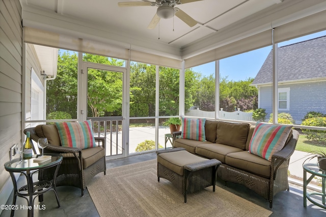 sunroom with ceiling fan and an outdoor hangout area