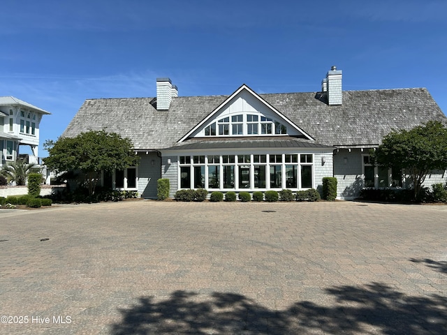 rear view of house with a chimney