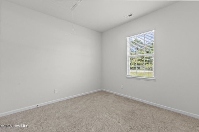 5900 Santo Domingo Ct, New Bern, NC 28560 - carpeted spare room featuring visible vents, attic access, and baseboards