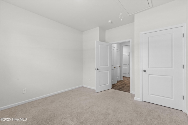 5900 Santo Domingo Ct, New Bern, NC 28560 - unfurnished bedroom with carpet floors, baseboards, and attic access