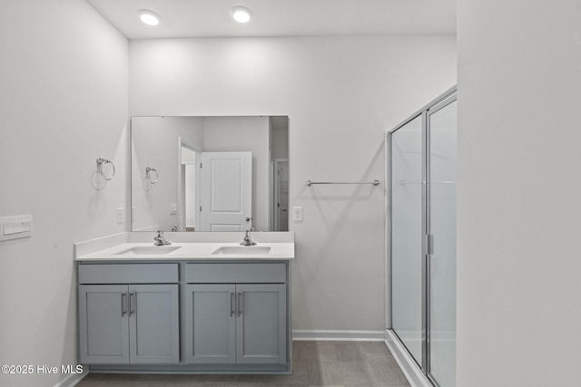 5900 Santo Domingo Ct, New Bern, NC 28560 - full bathroom with baseboards, a sink, a stall shower, and double vanity