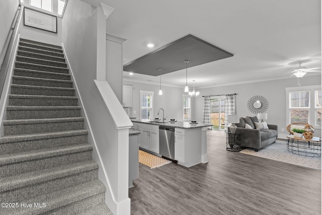 761 Cypress Village Pl, Wilmington, NC 28412 - stairway featuring ceiling fan with notable chandelier, wood finished floors, recessed lighting, and crown molding
