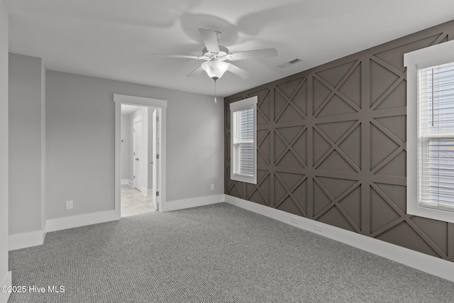 761 Cypress Village Pl, Wilmington, NC 28412 - empty room featuring plenty of natural light, baseboards, visible vents, a ceiling fan, and carpet floors