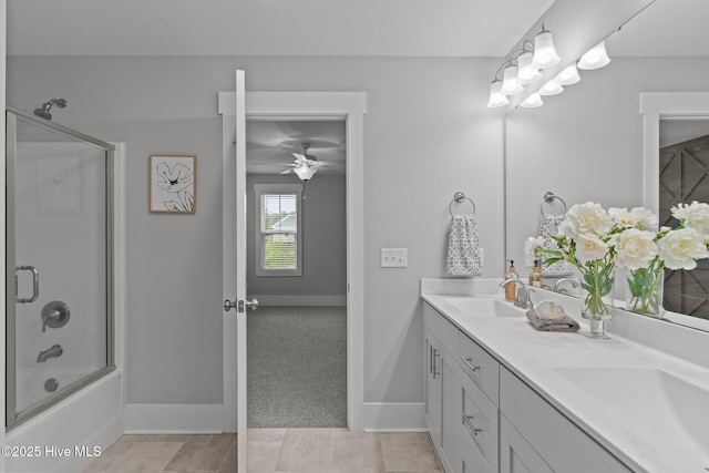 761 Cypress Village Pl, Wilmington, NC 28412 - bathroom featuring double vanity, baseboards, a sink, and shower / bath combination with glass door