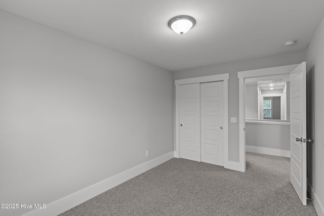 761 Cypress Village Pl, Wilmington, NC 28412 - unfurnished bedroom with carpet, a closet, and baseboards