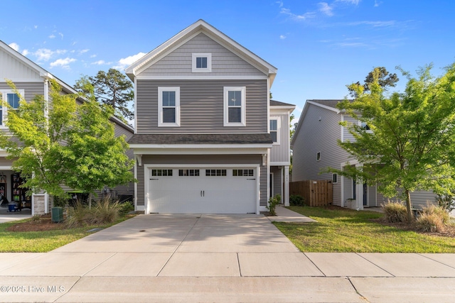 761 Cypress Village Pl, Wilmington, NC 28412 - traditional home with fence, concrete driveway, a front yard, and a garage